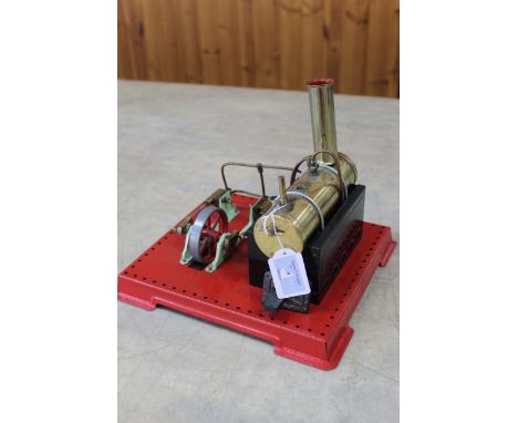 An early Mamod model stationary steam engine on painted red stand