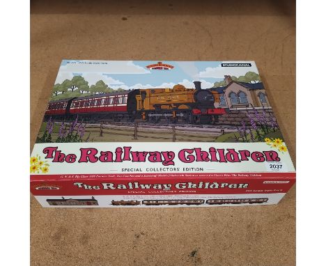 A boxed 'The Railway Children' special collectors edition containing engine, two coaches and a model of Oakworth Station