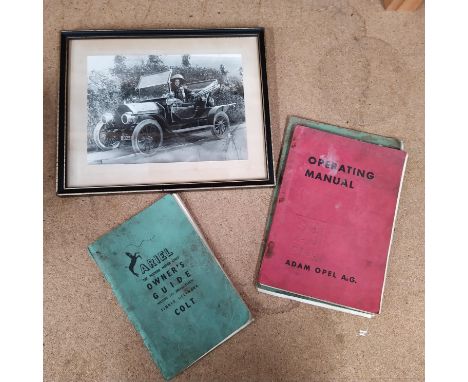 A 1935 Opel operating manual plus The Ariel Colt Owners Guide and the Essex Super 6 instruction book and a framed photo of a 