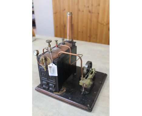An early 20th Century cast iron hand built stationary steam engine with steam whistle