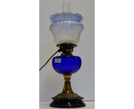 22" PARAFFIN LAMP (CONVERTED) WITH BLUE GLASS RESERVOIR & BLUE GLASS SHADE WITH FUNNEL, ON TAPERED BRASS BASE     
