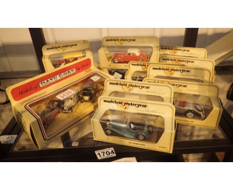 Twelve Yesteryear diecast model cars, plus a boxed three