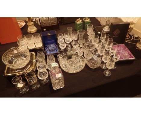 Large quantity of crystal glassware including champagne flutes, whiskey glasses, decanter etc