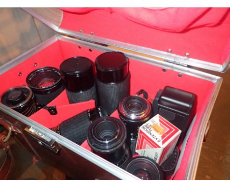 Box of mixed camera lenses and Olympus XA3 camera