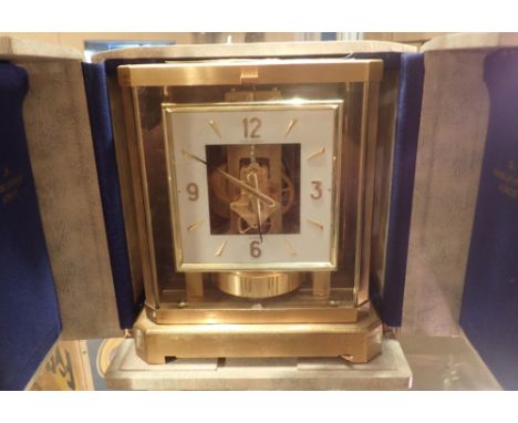 Jaeger Lecoultre Atmos clock in original box, 22.5 x 17 cm   CONDITION REPORT:  This item is working at lotting.