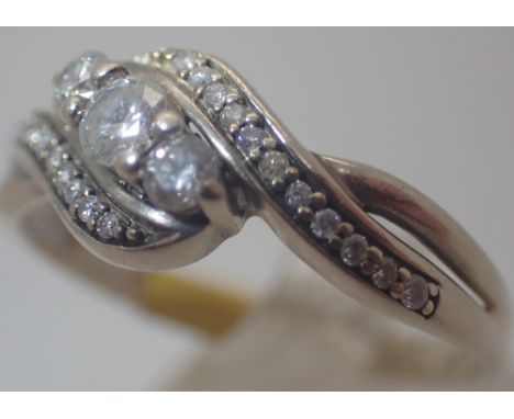 9ct white gold diamond three stone ring set with diamond shoulders, size Q 1/2