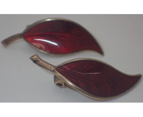 Pair of Norwegian silver clip on earrings shaped as leaves, decorated in red enamel 