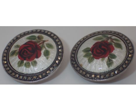 Pair of silver clip on earrings with enamel decoration of red roses, edged with marcasite