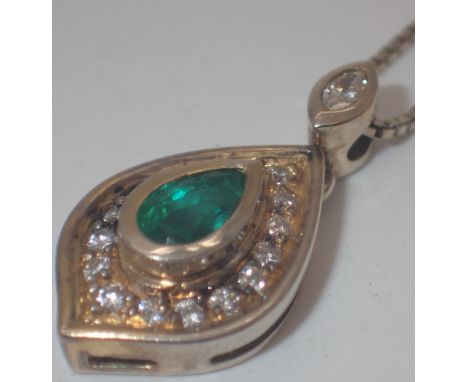 18ct gold green stone and diamond pendant on a 18ct gold chain, 5.9 g   CONDITION REPORT:  Good condition, minor surface use 