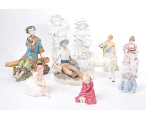 A collection of vintage 20th century porcelain china figurines. To include, ballerinas, clowns, baby, Nao / Lladro style, whi