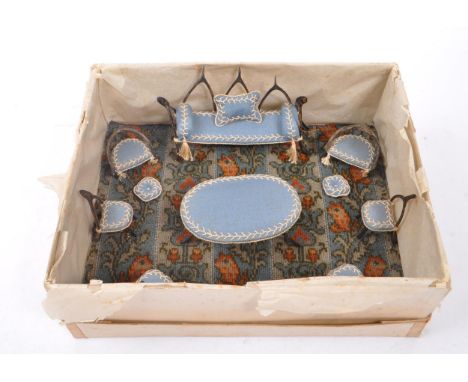 A collection of eleven late 19th Century miniature / dolls house wishbone furniture painted brown, having upholstered blue an