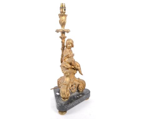 An early 20th century Neoclassical table electric lamp light. Having a gilt foliate column with light fixing to top, girl sat