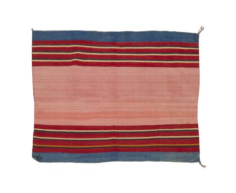 Navajo adult wearing blanket. With a central light red field bordered by stripes of deep red, yellow, black, and blue.Height: