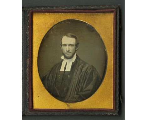 Daguerreotype photograph depicting a portrait of a clergyman, likely Protestant. Housed under glass in a gilt metal frame enc