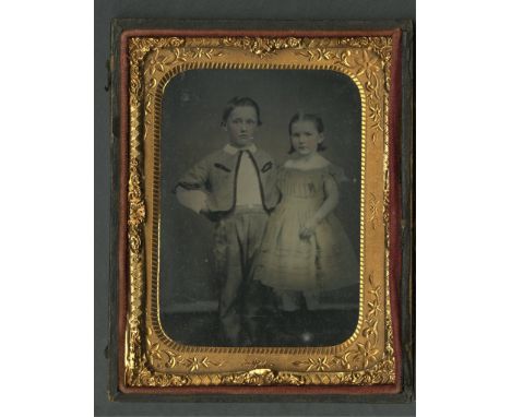 Quarter plate tintype photograph depicting a portrait of two children with hand-colored rosy cheeks. Housed under glass in a 