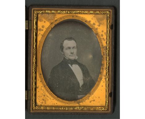 Daguerreotype portrait photograph depicting a well-dressed gentlemen. Housed in an ornate gutta-percha or thermoplastic case.