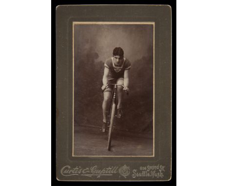 Edward Curtis (American, 1868-1952). Vintage cabinet card or carte de visite photograph depicting a bicyclist. Written in pen