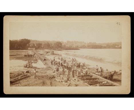 Edward Curtis (American, 1868-1952). Carte de visite photograph depicting workers building a railroad or dam.Provenance: From
