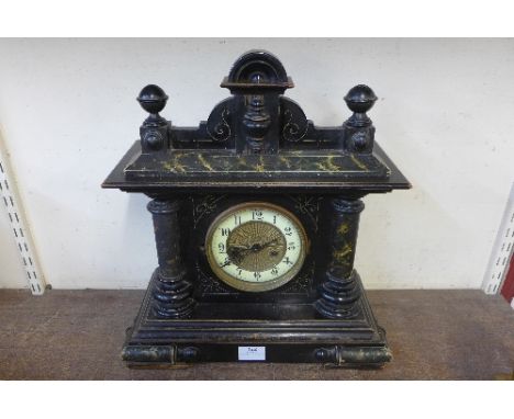 A 19th Century American faux marble mantel clock