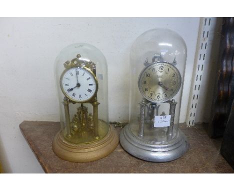 A chrome finished Violleta anniversary clock and a brass anniversary clock