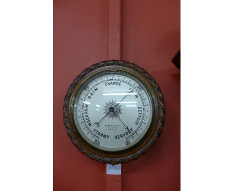 A Victorian carved oak aneroid barometer, the dial signed Benetfink &amp; Co., Cheapside, London