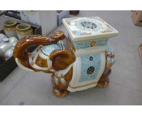 A ceramic garden elephant seat