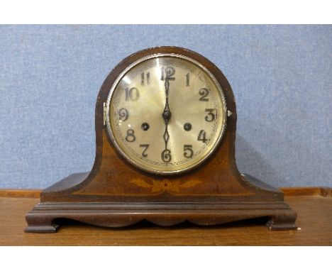 An inlaid mahogany mantel clock