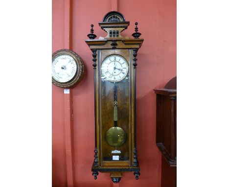A 19th Century walnut single weight Vienna wall clock