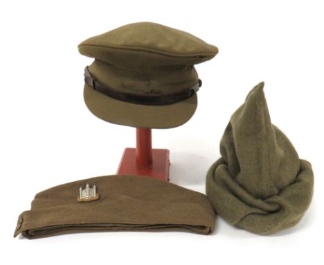 3 x British Army Capsconsisting Officer's khaki service dress cap.  Brown leather chinstrap secured by RA buttons.  Badge abs