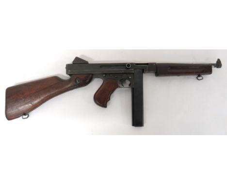 Deactivated US Thompson M1A1 SMG10 1/2 inch, .45 ACP with end blade sight.  Square form body with side operating bolt handle.