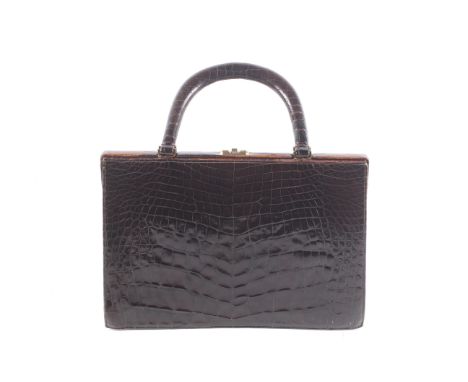 A vintage Modell Royal brown crocodile skin handbag. Of tapered form with twin handles and a clip lock clasp, the interior li