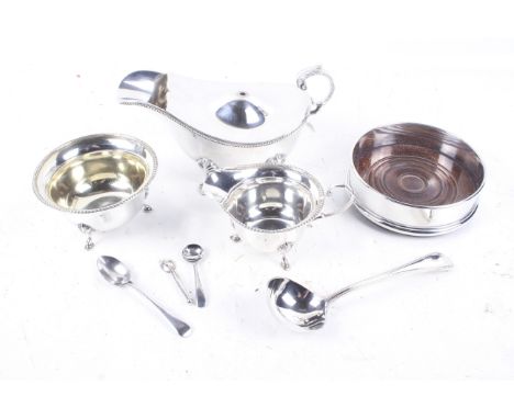 A silver old English bead sauce ladle and various silver-plated items including a sauce boat. The silver sauce ladle with hal