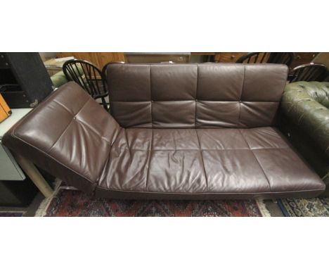 A Ligne Roset Smala brown leather sofa bed. Raised on metal support. With manual drop/raise back and arm. Bed size L215cm x D