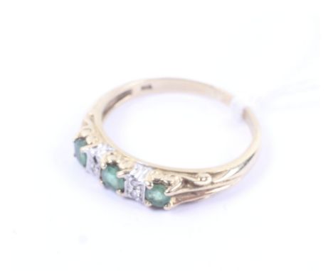 A vintage 9ct bi-colour gold, emerald and diamond cast half-hoop ring. The three round mixed-cut emeralds spaced by small dia