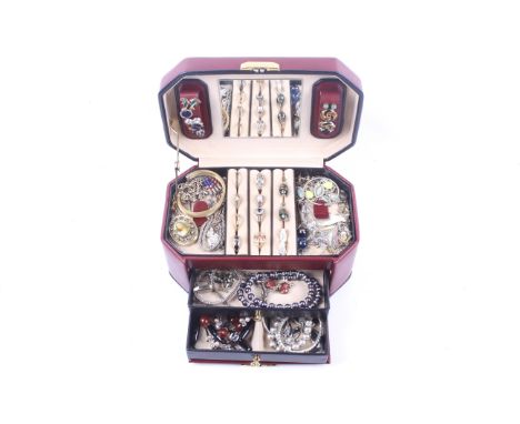 A tooled leather jewellery box and contents including rings, bracelets, watches etc