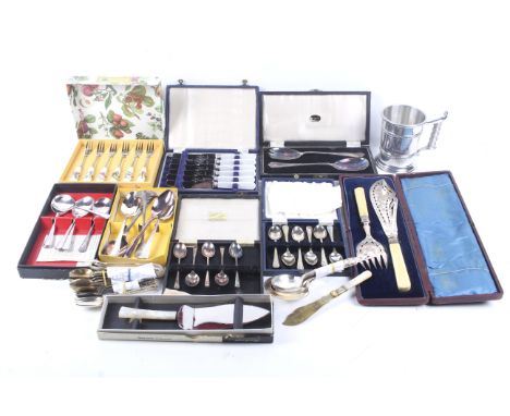 A collection of silver-plated items. Mostly flatware, including teaspoons, dessert spoons, a cake slice and more, some in box