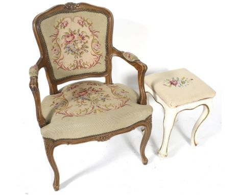 A 20th century French Fauteuil chair and and a similar stool. The chair with carved supports, H91cm, both with pale coloured 
