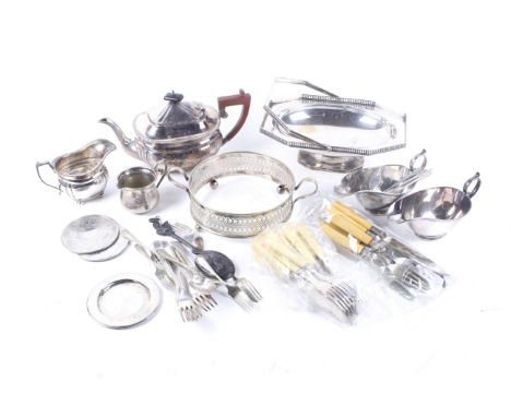 A large quantity of silver plate. Including an oblong tea pot with a composition handle, an oblong pedestal cake basket with 