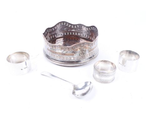 A silver napkin ring and other items. Comprising; a silver napkin ring inscribed 'Simon', 35g; two silver-plated napkin rings