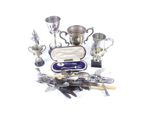 A collection of silver plated items. Including trophies, mugs, knife rest and flatware