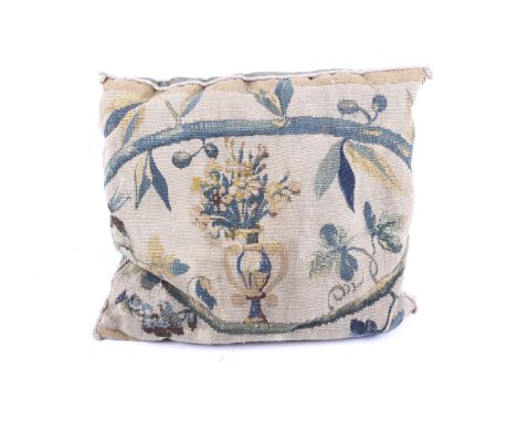 A fragment of a 17th or 18th century Flemish verdure tapestry converted into a cushion. The front woven with urn filled with 