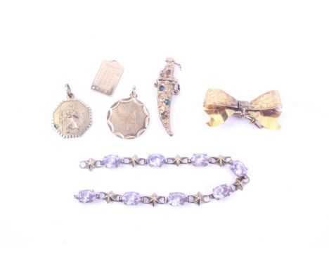 A collection of vintage gold jewellery including an Edwardian floral-engraved ribbon-tied bow fob. Hallmarks for Chester 1907