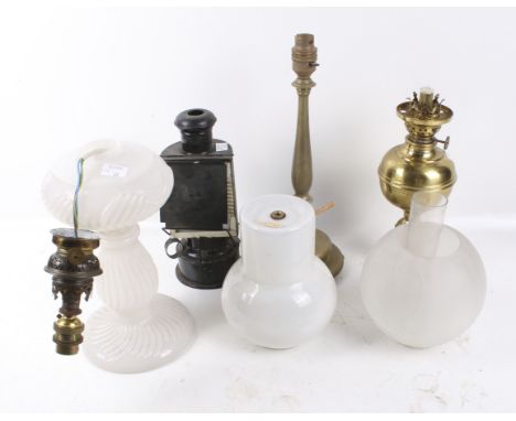 A group of four assorted table lamps. Including a brass oil lamp, the rest converted to electric, one with opaline white glas