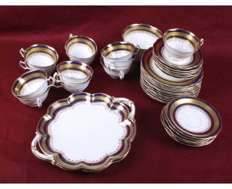 An early 20th century George Jones & Sons Crescent china tea set. Including twelve cups, two sandwich plates and twelve sauce