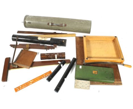 Vintage collection of assorted artist materials. Including a folding travel easel, brushes, tin tubes, architectual blue prin