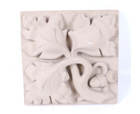 An acorn and oak leaf decorated relief ceramic tile. 21cm x 21cm