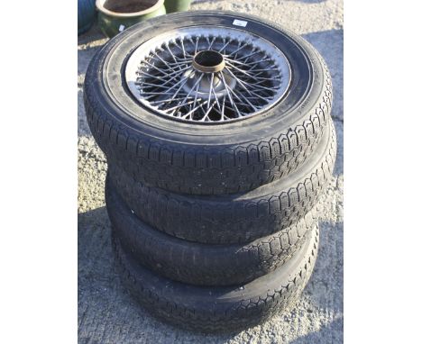 A set of four vintage MG sportscar wire wheels. With four tyres: Michelin X 165 15 Z X Radial. 