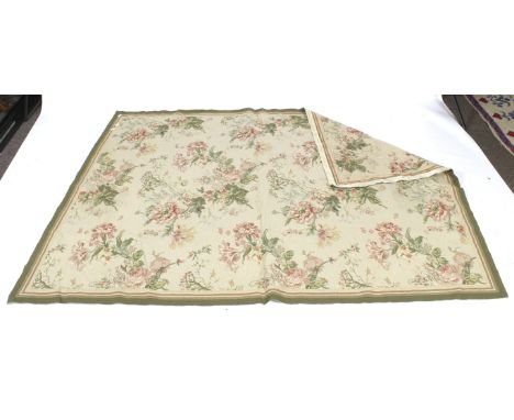 A 20th century tapestry. Depicting a pattern of roses on a tan ground, 152cm x 215cm