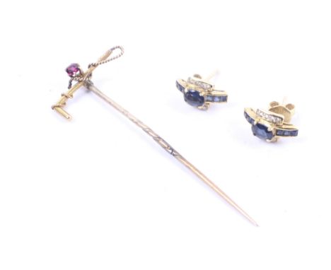 An early 20th century gold and garnet single stone riding crop stick pin and earrings. The second of dark-blue sapphire and c