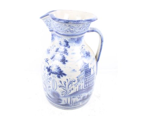 A very large blue and white 'Delftware' jug. With a scene of two gentlemen walking in a garden. H49cm